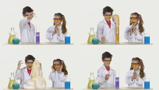 两个可爱的化学家孩子做有趣和成功的实验孤立在白色背景，慢动作高清在线视频素材下载