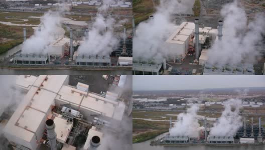 从空中拍摄的浓烟从工业建筑中滚滚而出高清在线视频素材下载