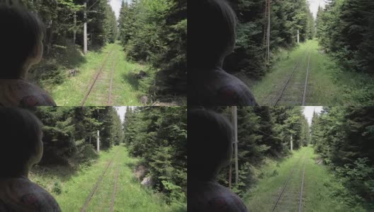 从森林里最后一辆马车上望着铁路的女孩——佐治亚高清在线视频素材下载
