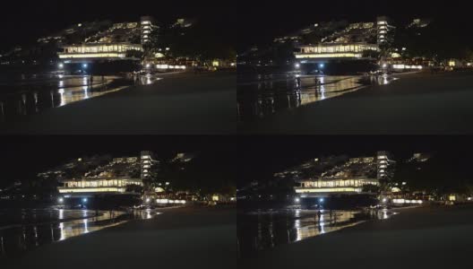 夜晚的海滩，以城市为背景高清在线视频素材下载