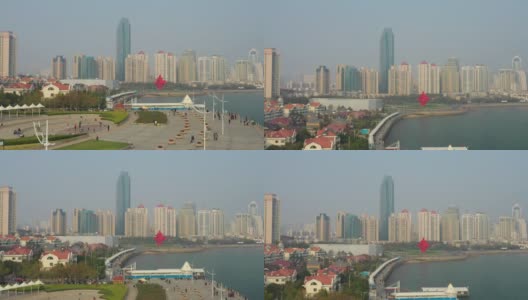 阳光灿烂的日落青岛著名的步行湾公园码头现代纪念碑广场航拍全景4k中国高清在线视频素材下载