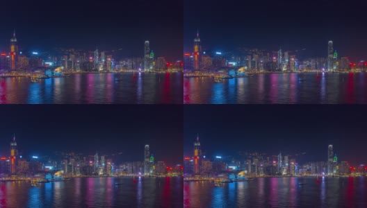 夜光飞行在香港城市市中心港湾的空中全景，4k时间间隔高清在线视频素材下载