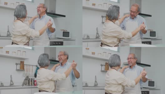 夫妇老亚洲长者幸福生活在家庭厨房。爷爷奶奶跳着幸福的舞蹈，微笑着享受退休生活。老年人的家庭关系和活动概念。高清在线视频素材下载