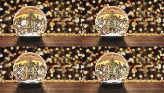 玻璃雪花球与飞舞的雪花背景圣诞灯高清在线视频素材下载