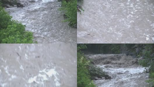 小溪在湍急的河流中转弯高清在线视频素材下载
