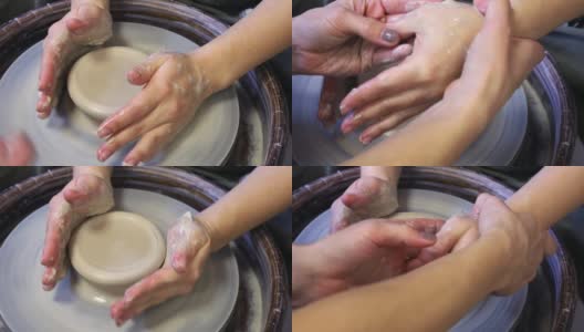 陶工大师的手向学生的手展示了陶工施加的正确压力高清在线视频素材下载