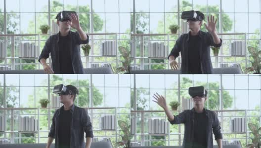 年轻人站着，用VR做手交互高清在线视频素材下载
