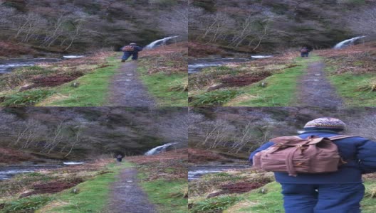 一个退休老人走在河边的小路上高清在线视频素材下载