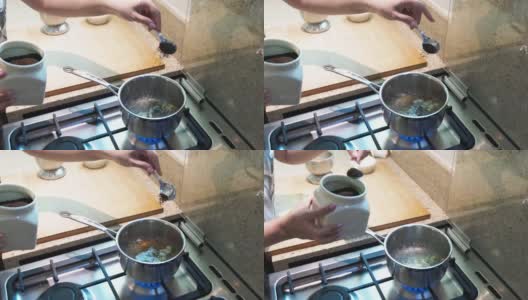 在厨房里做印度香料茶的女人高清在线视频素材下载