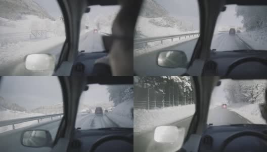 雪中行驶的POV车:冬季的山口高清在线视频素材下载