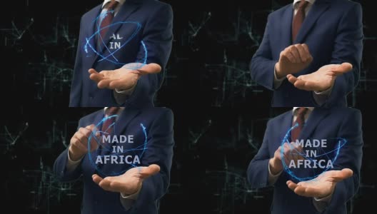 商人在手上展示非洲制造的全息概念图高清在线视频素材下载