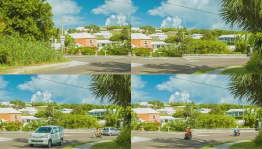 车辆和滑板车穿过百慕大的村庄高清在线视频素材下载
