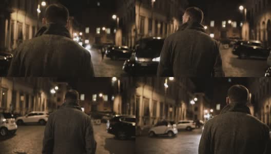 年轻时尚的男人走在深夜穿过黑暗的街道，在晚上独自走高清在线视频素材下载