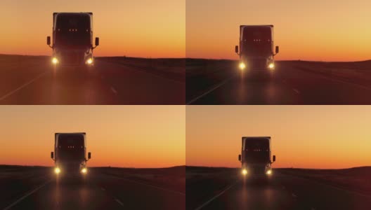 近距离镜头光晕:在金色的夕阳下，半卡车直接撞向摄像机高清在线视频素材下载