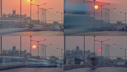 在印度孟买，夕阳西下的班德拉沃里海，也被称为拉吉夫甘地海，同时移动的交通和行人在前景高清在线视频素材下载