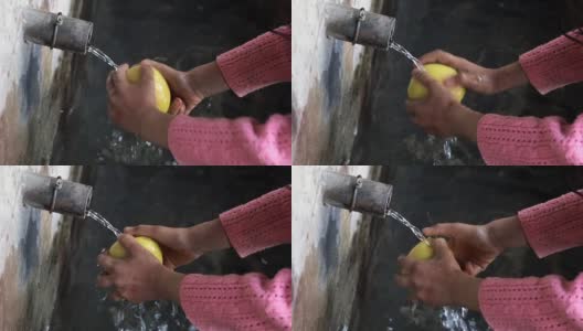 Cute Girl Washing Yellow Apple高清在线视频素材下载