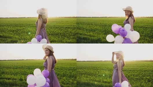 美丽的女孩拿着五颜六色的气球走在春天的田野上高清在线视频素材下载