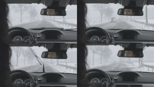 冬天开车-在大雪下的乡村道路上开车要小心高清在线视频素材下载