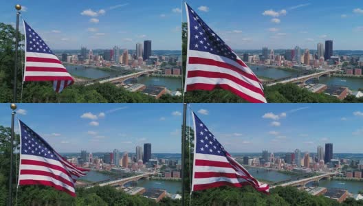 缓慢的空中推进美国国旗和匹兹堡天际线高清在线视频素材下载