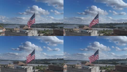 慢轨航拍美国国旗在小镇高清在线视频素材下载