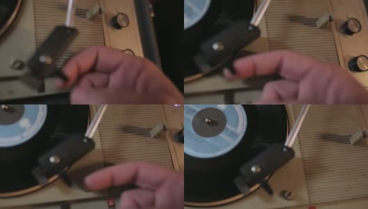 手的特写放置在黑胶唱片上的针高清在线视频素材下载