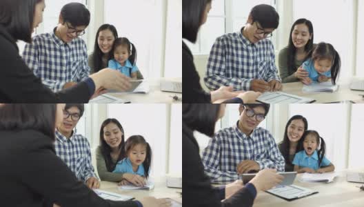 年轻的亚洲夫妇签订合同并购买房子，房地产经纪人高清在线视频素材下载