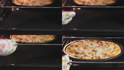 用电热对流烤箱烹饪披萨。将披萨放在冷却器内的热烤盘上。鸡肉黄瓜和奶酪的披萨高清在线视频素材下载