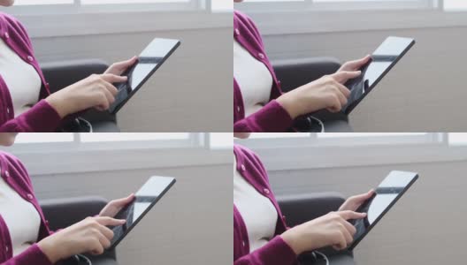 手用数码平板电脑，亚洲女孩玩手机高清在线视频素材下载