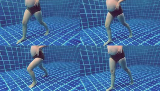 孕妇在游泳池里锻炼。高清在线视频素材下载