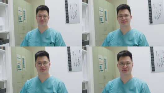 一个年轻的男护士在医院工作的肖像高清在线视频素材下载