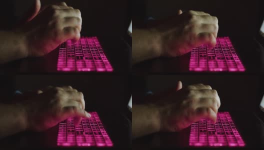 男人的双手特写在晚上在笔记本电脑键盘上打字高清在线视频素材下载