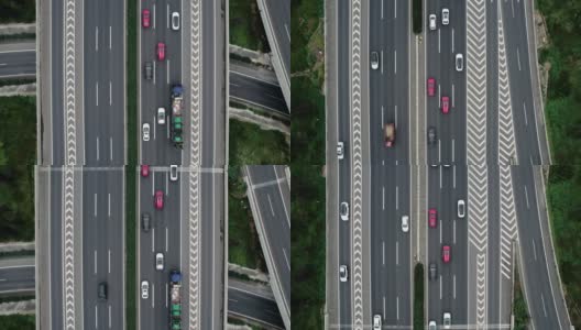 从无人机上俯视大城市多车道高速公路现代交通枢纽。高速公路上交通拥挤。跟随正确方向的车辆。高清在线视频素材下载