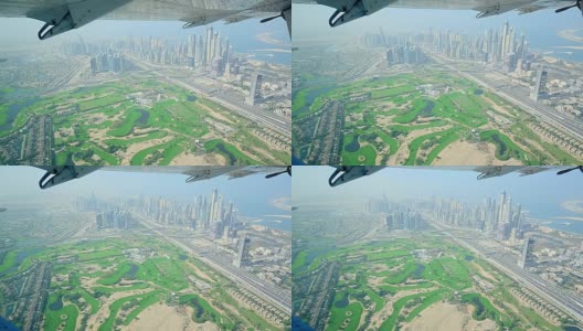 从飞机上鸟瞰迪拜码头，城市摩天大楼高清在线视频素材下载