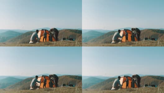 一家人在山顶搭帐篷高清在线视频素材下载