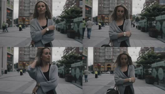 女人走在城市街道上，慢镜头高清在线视频素材下载