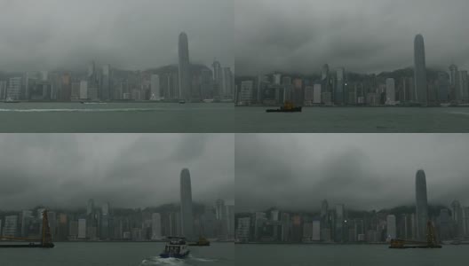 迷雾中的烟雾和黑暗中的城市/中国香港，放大。高清在线视频素材下载