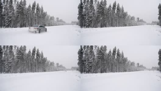 大雪期间，一辆汽车在森林路上经过高清在线视频素材下载