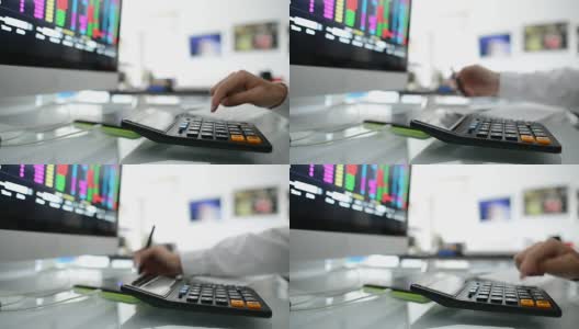商人在办公室用数字平板电脑和笔记本电脑分析股市高清在线视频素材下载