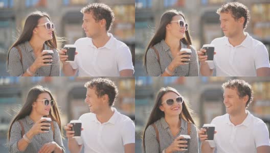 在阳光明媚的夏天，可爱的夫妇坐在城市广场的长椅上喝咖啡的特写肖像高清在线视频素材下载