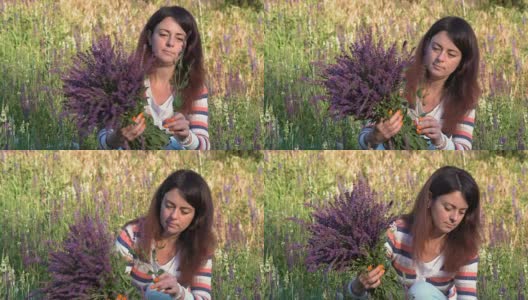 特写，美丽的女人收集矢车菊花束，坐在野外的花在早晨在树林里高清在线视频素材下载