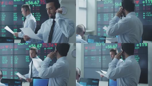 西班牙裔股票经纪人在证券交易所使用耳机积极交谈。高清在线视频素材下载
