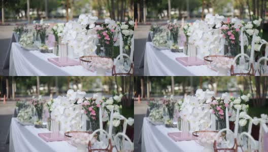 婚礼装饰用各种花束放在户外的桌子上。高清在线视频素材下载