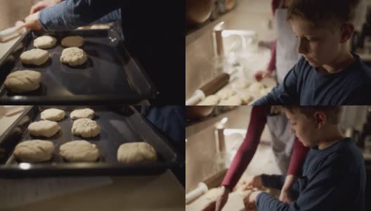 母亲和儿子在烤小面包高清在线视频素材下载