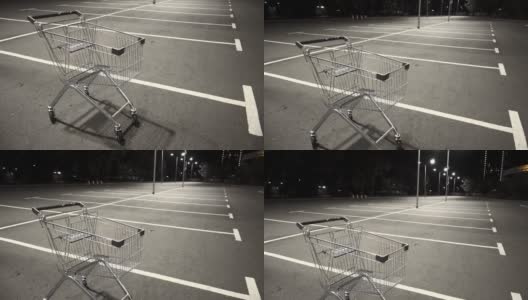 晚上，购物车停在一个空的停车场。高清在线视频素材下载