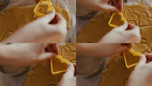 厨师的手从饼干面团上切出心形高清在线视频素材下载