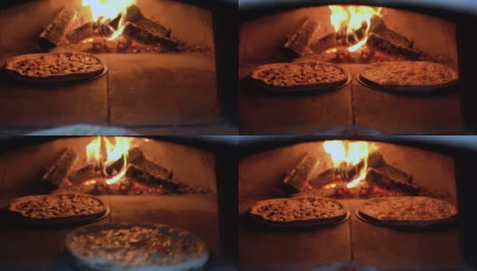 马苏里拉奶酪披萨是在露天的柴火烤箱里烤的。在砖炉里烤披萨。烤披萨店高清在线视频素材下载