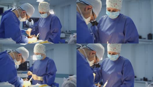 神经外科医生在手术室辛勤工作。团队外科医生在手术室工作。高清在线视频素材下载