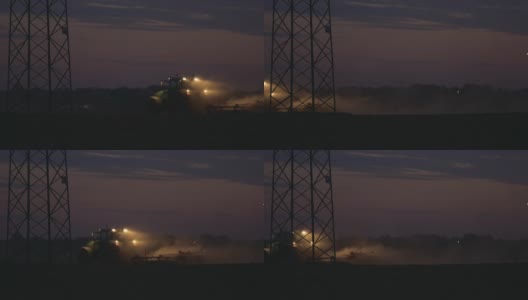 SLO MO拖拉机在黄昏后犁地高清在线视频素材下载