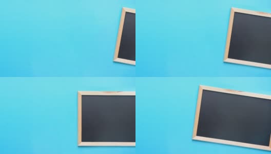 在蓝色背景上黑色黑板的空白模拟的定格动画镜头。回到学校观念教育高清在线视频素材下载