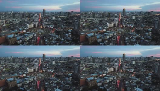 日落时城市的鸟瞰图。飞越泰国曼谷巨大的回旋处高清在线视频素材下载